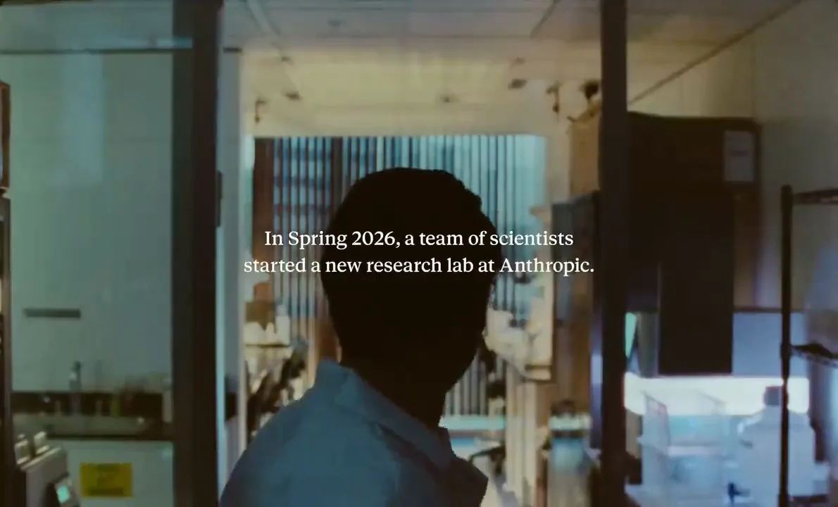Силуэт учёного в дверях лаборатории и титр In Spring 2026, a team of scientists started a new research lab at Anthropic